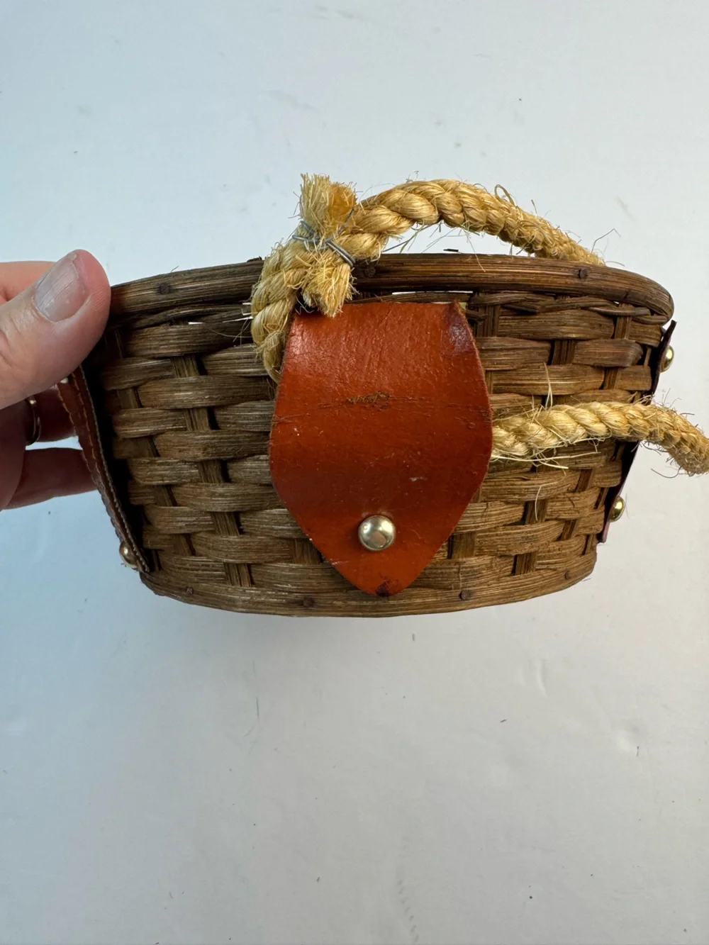 Vintage mid-centuryWoven Straw basket with Brown Leather Panels and Rope Handle